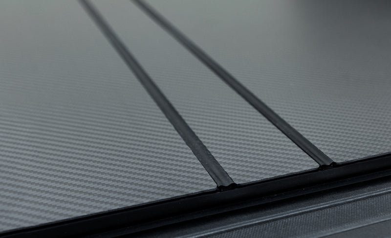 Access LOMAX Pro Series Hard Tri-Fold Tonneau Cover accB5050079 for 2022-2023 Toyota Tundra 5 ft 6 in Bed, Carbon Fiber