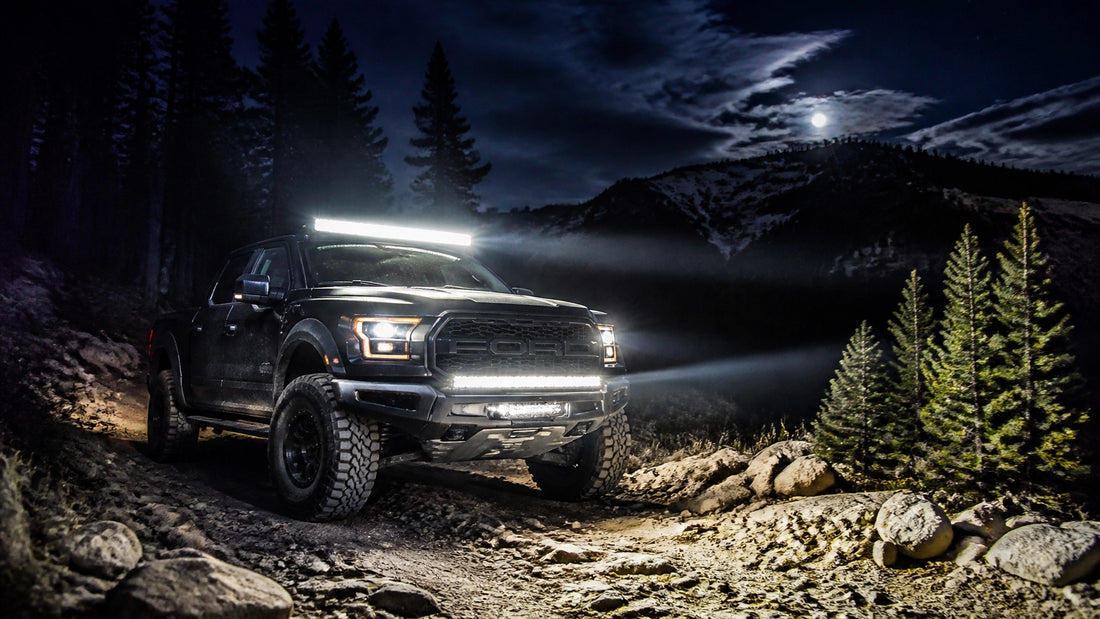 Off-road truck on Montana trail with LED lights