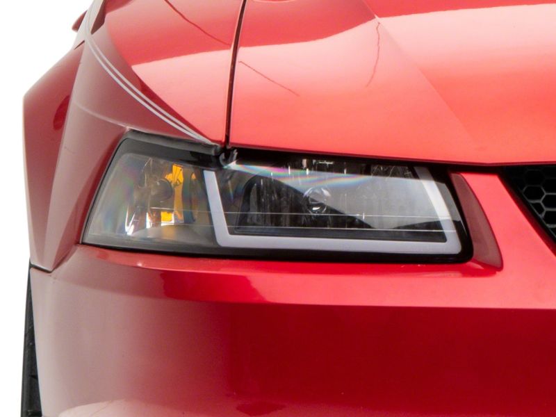 Raxiom Axial Series Headlights with Sequential LED Bar for 1999-2004 Ford Mustang, Black Housing, Clear Lens