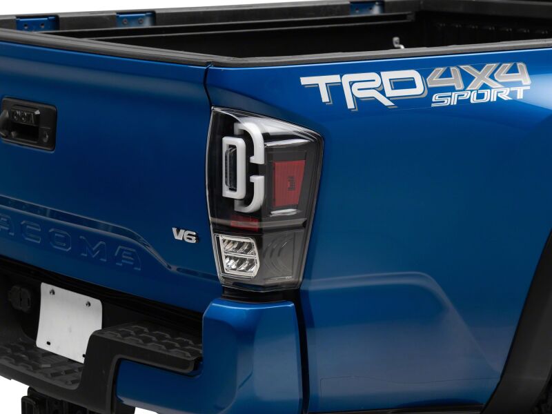 Raxiom 16-23 Toyota Tacoma XW Series Sequential LED Tail Lights with Black Housing and Clear Lens