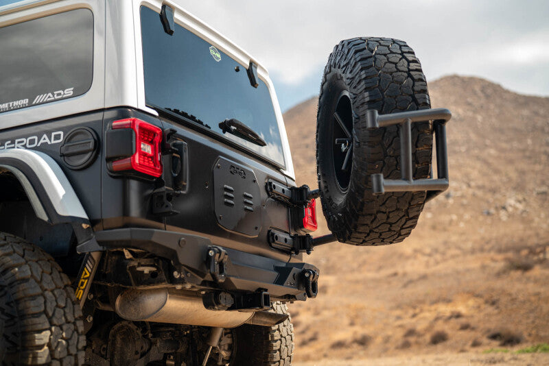 DV8 Offroad Body Mounted Tire Carrier for 2018–2025 Jeep Wrangler JL, Part Number dveTCJL-14
