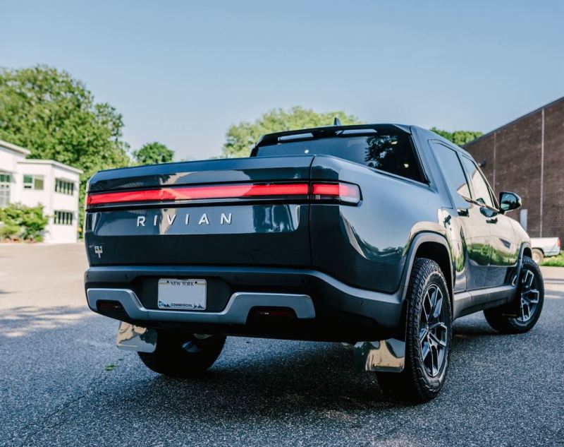 Rally Armor 2022 Rivian R1T Black UR Mud Flap w/ Tangerine Scream Logo