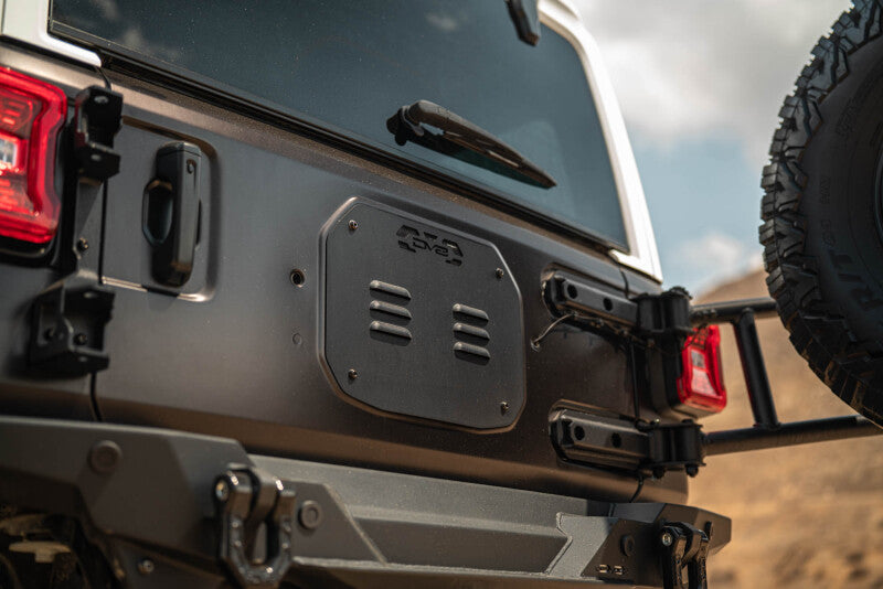 DV8 Offroad Body Mounted Tire Carrier for 2018–2025 Jeep Wrangler JL, Part Number dveTCJL-14